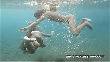 Play Julia and Masha are swimming nude in the sea
